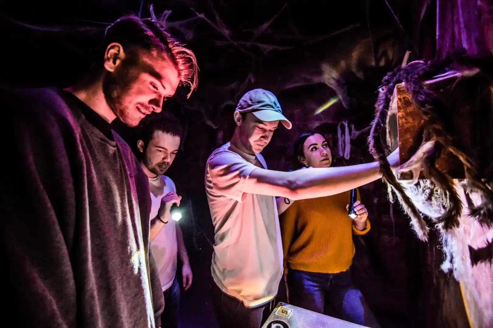 Friends celebrating together inside an Escape Reality themed escape room during a hen do.