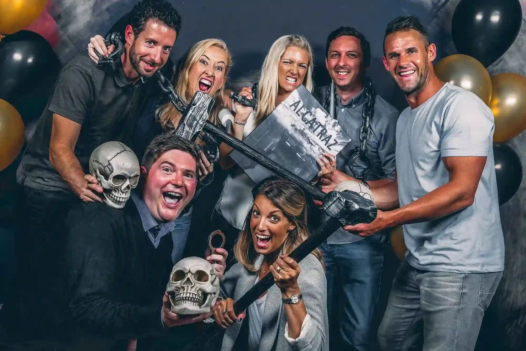 Birthday party team celebrating after successfully escaping an Escape Reality room.