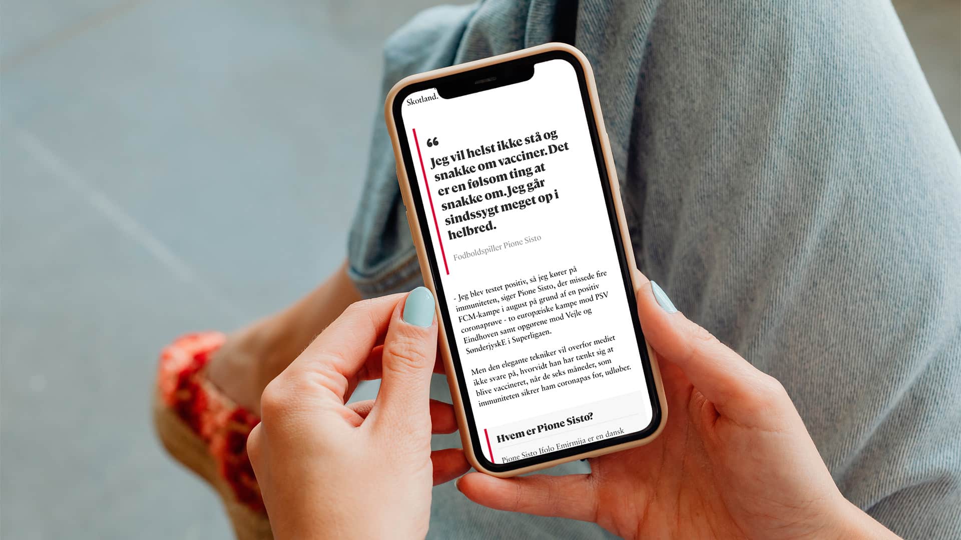 Phone with article in hand