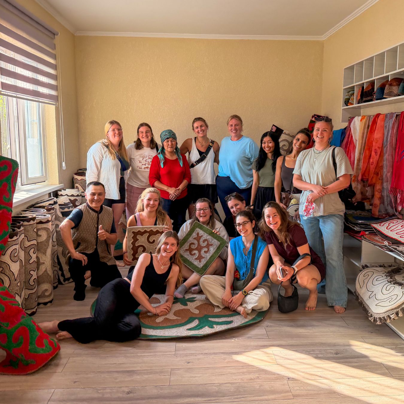Stay Wild group with local hosts after a felt-making class in Kyrgyzstan