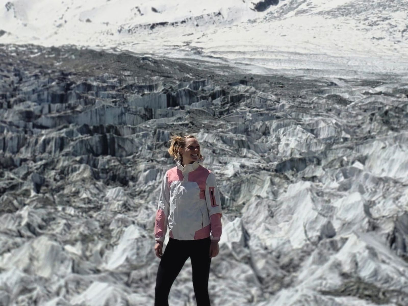 Woman standing on a glacier in northern Pakistan