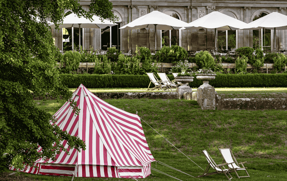 The gardens of Cowley Manor in early spring, with the first snowdrops.