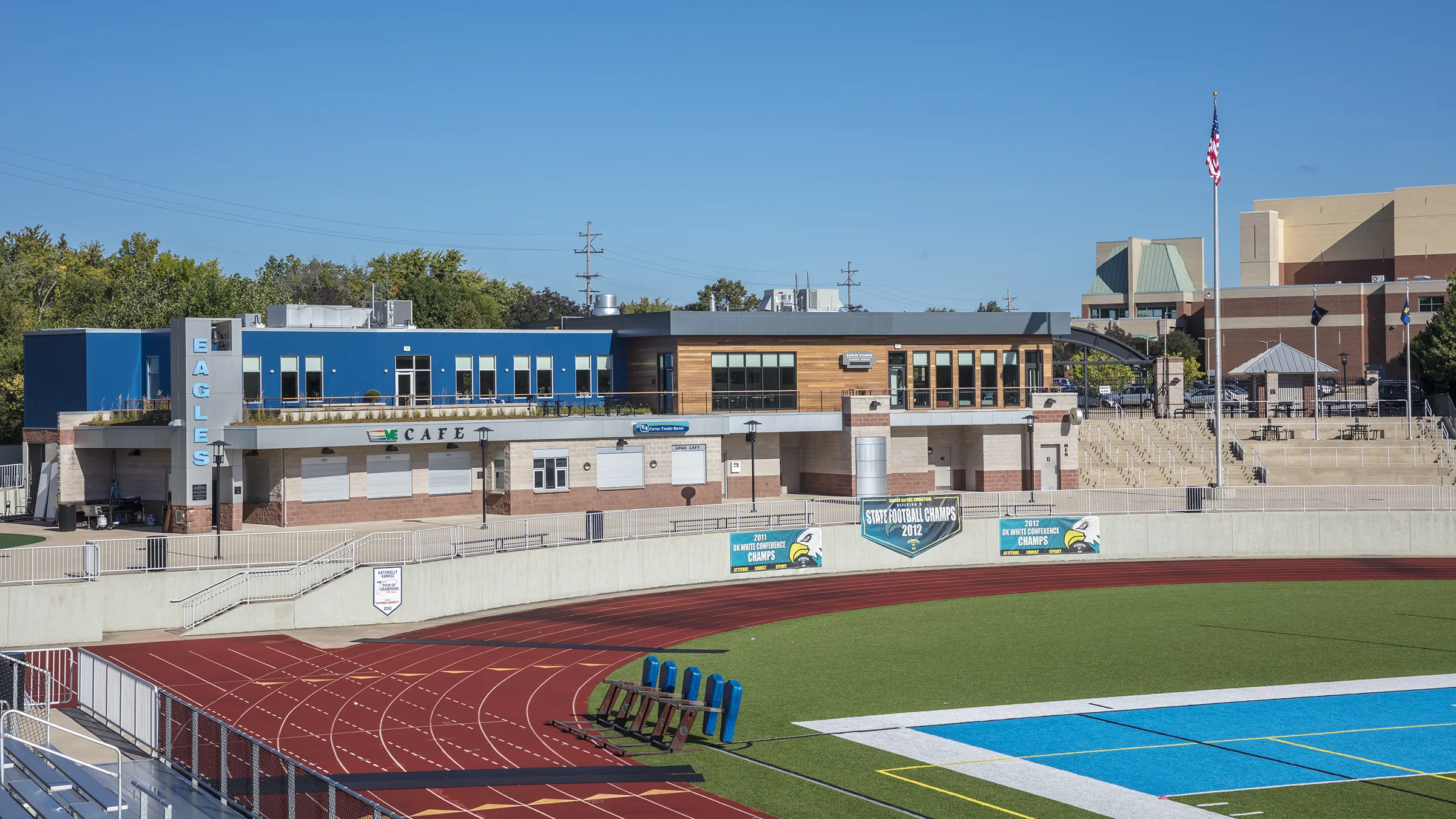 Grand Rapids Christian School's new administrative building and observation deck overlooking football field and track.
