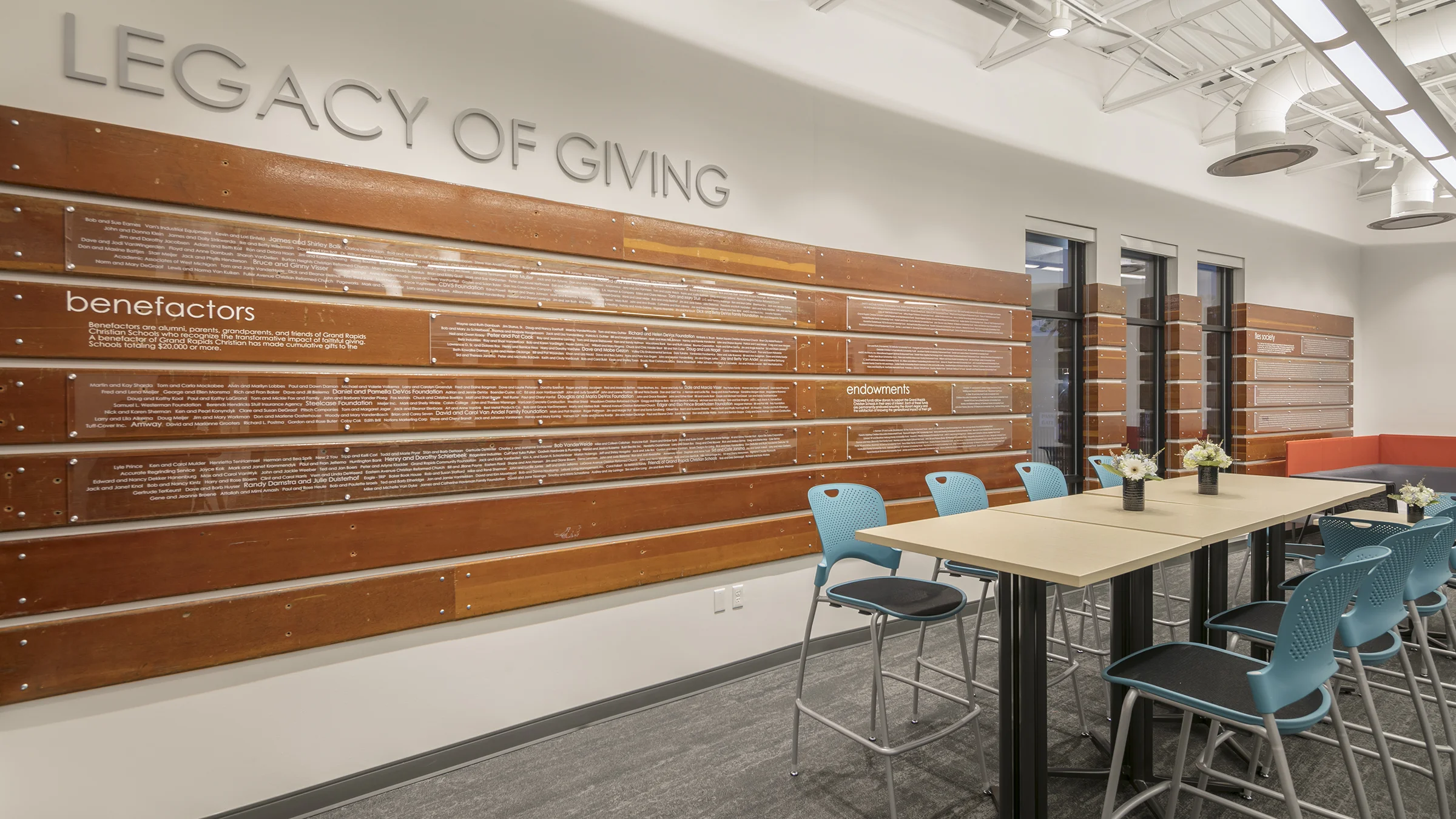 Wooden legacy wall of donors inside Grand Rapids Christian School's administrative building.