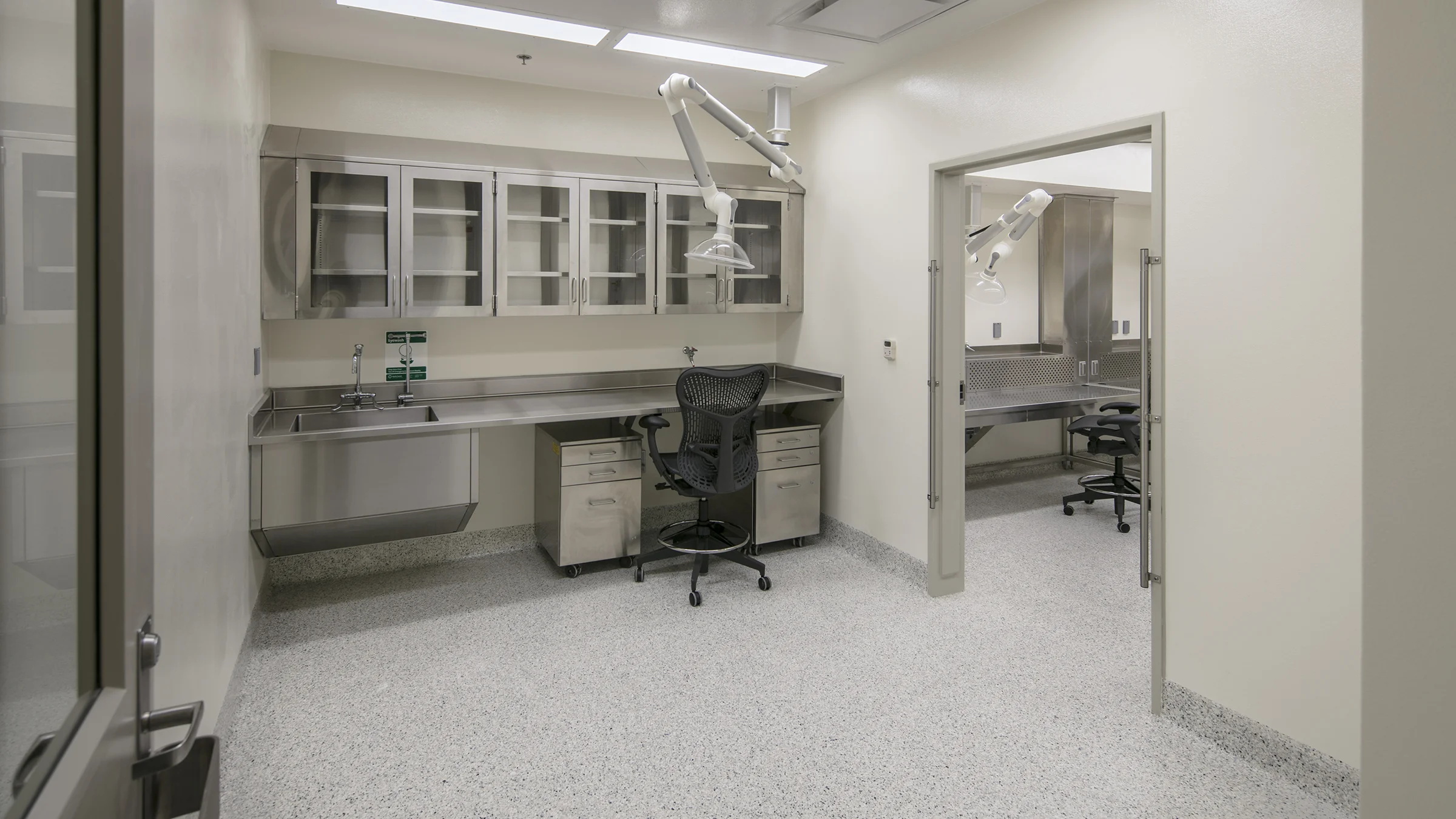 Controlled medical research lab with stainless steel workstations inside Michigan State University’s Grand Rapids Research Center.