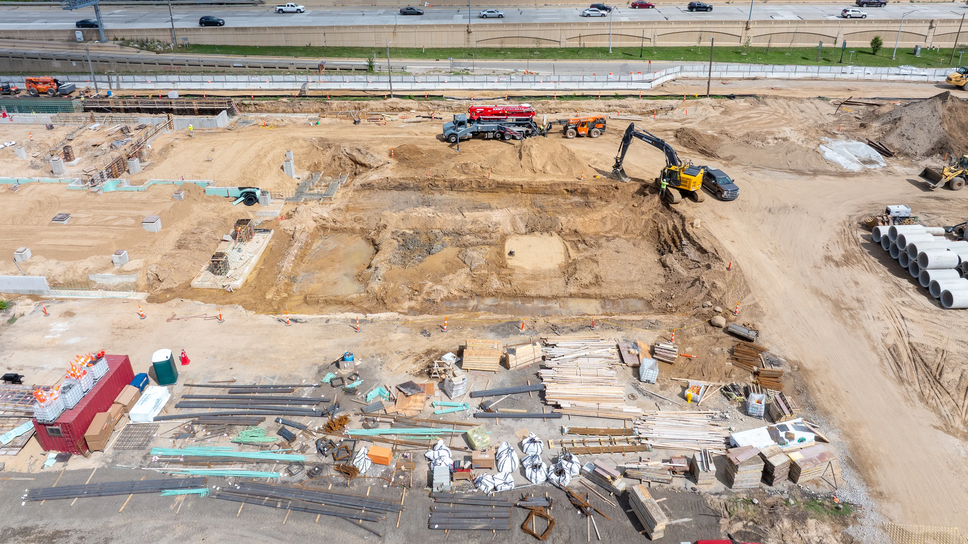 construction zone with dug out area and materials on the side