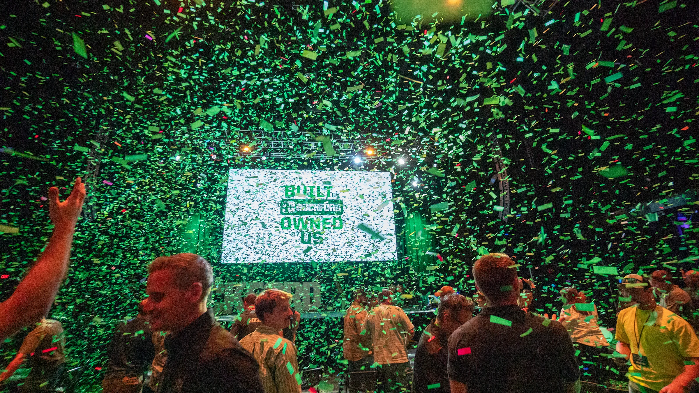 Green confetti falling after Rockford Construction announced ESOP status.