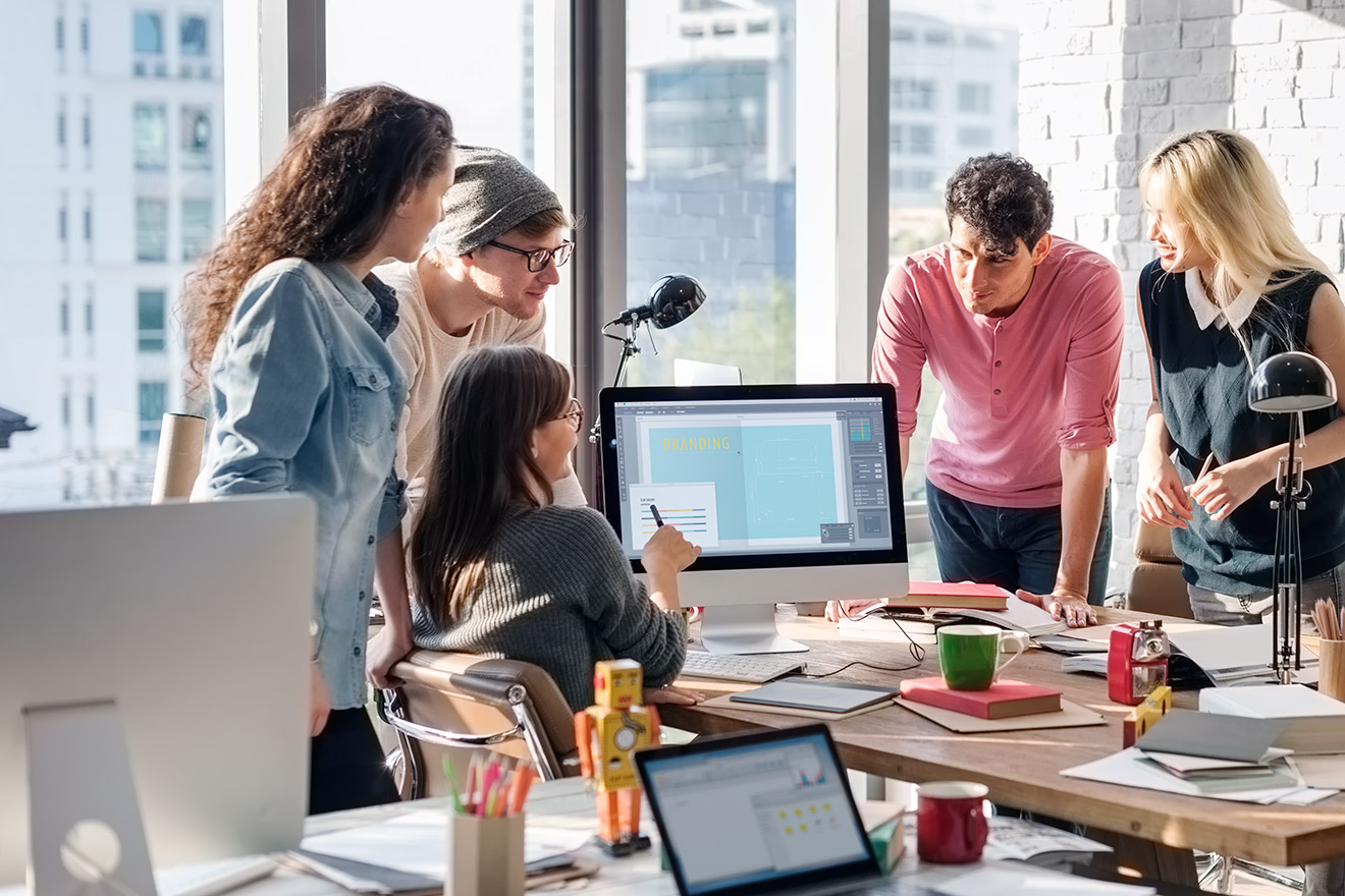 a group of people working in an office