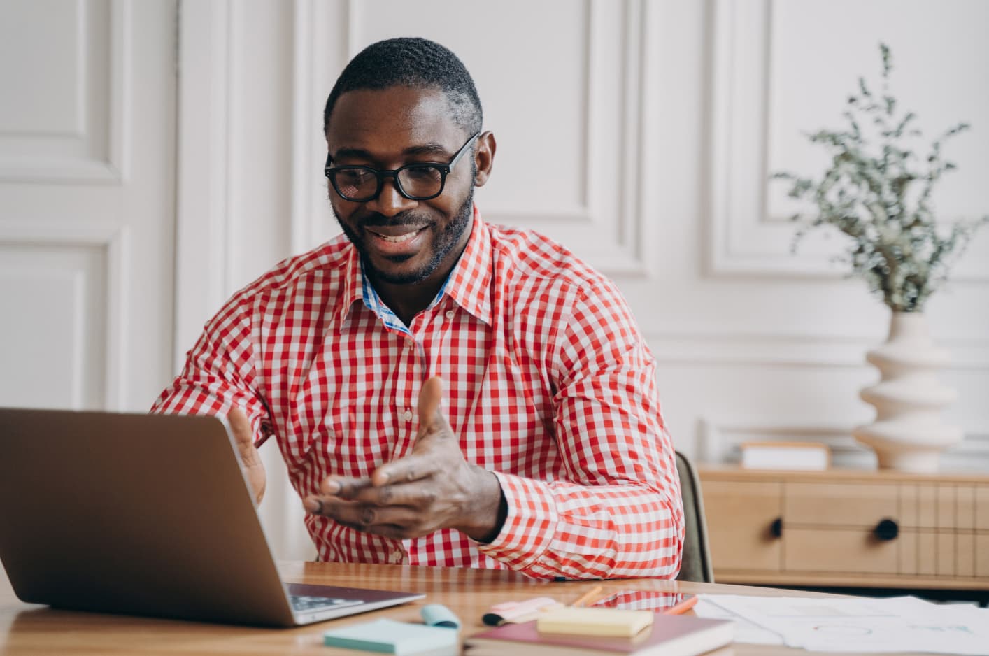 An image of a man conducting an online tutoring session.