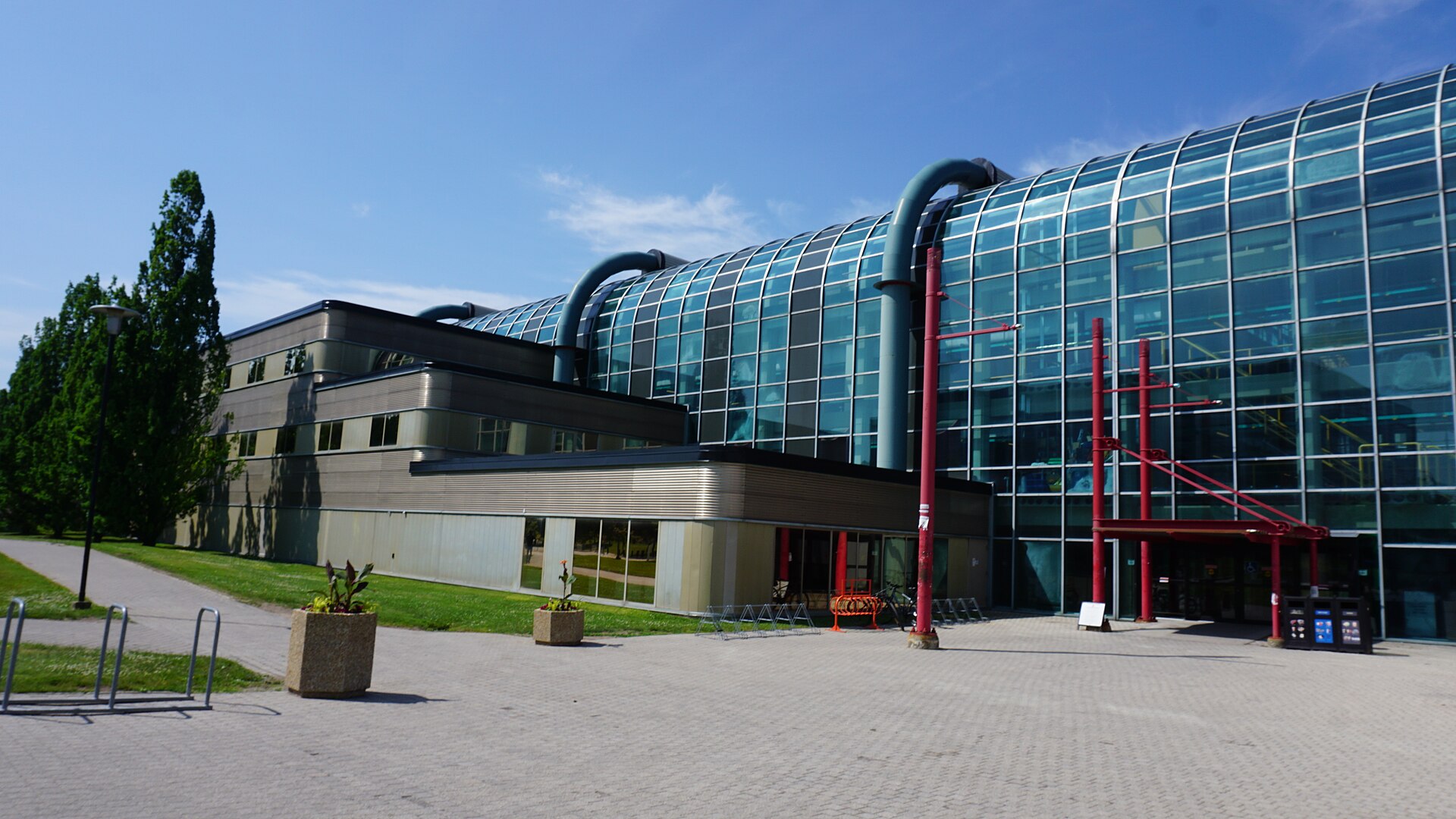 Glass-roofed Davis Centre with its red steel entrance, University of Waterloo