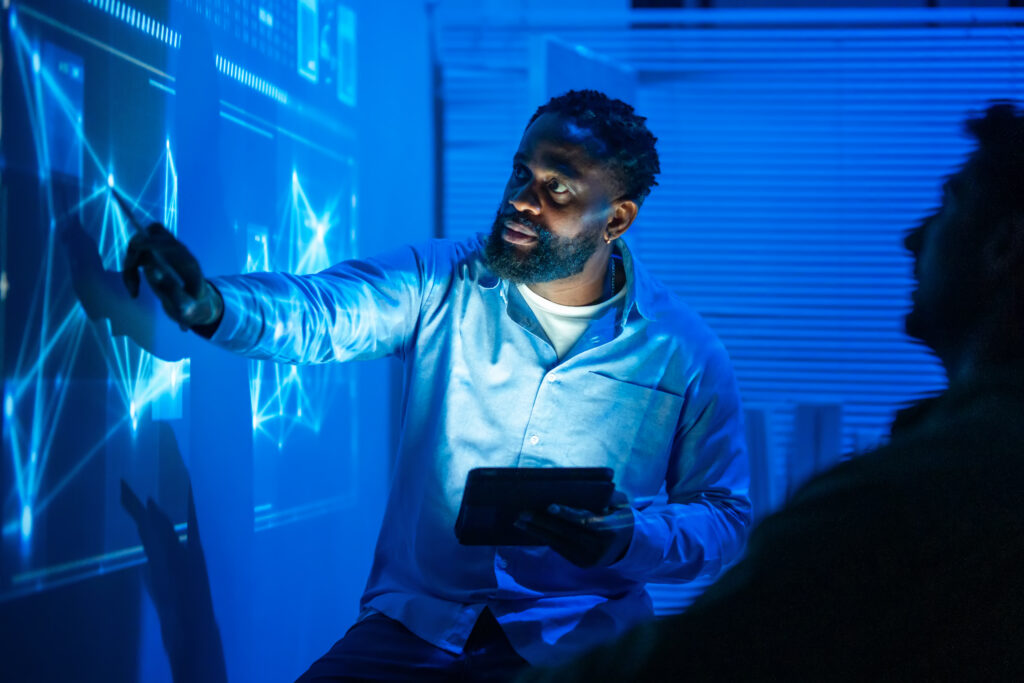 A man shows off AI topics for presentations.