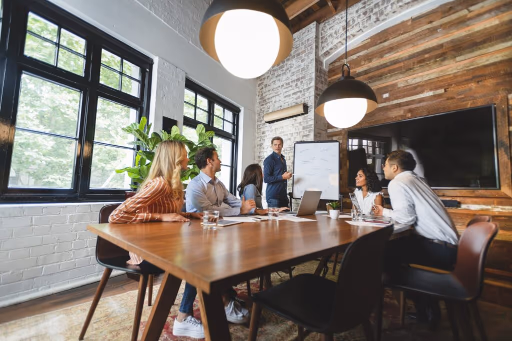 A picture of a sales training session with a team.