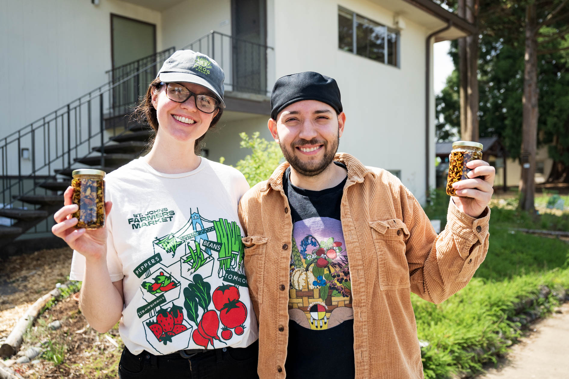 food entrepreneurs smile while holding their salsa macha