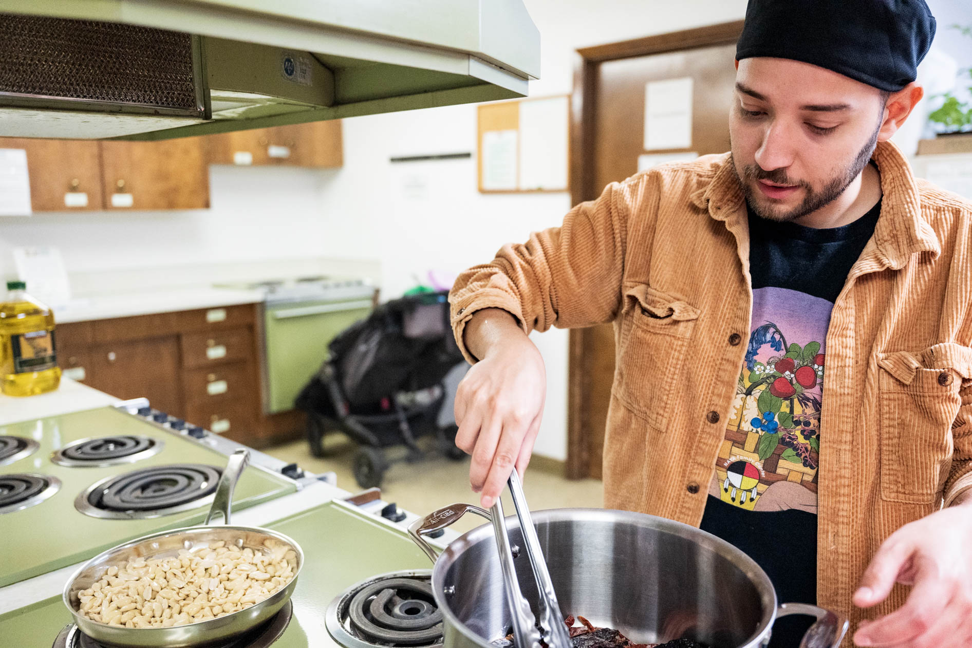 Juan toasts peppers before grinding