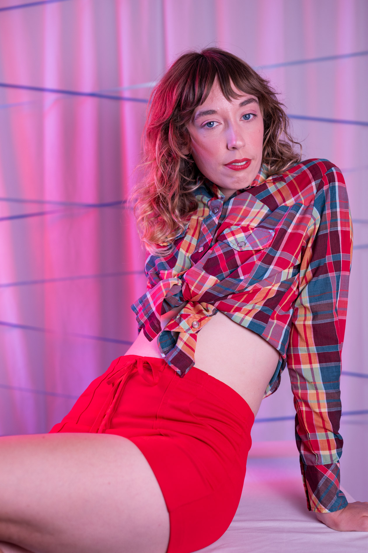 kayla, bathed in red, in our portland studio