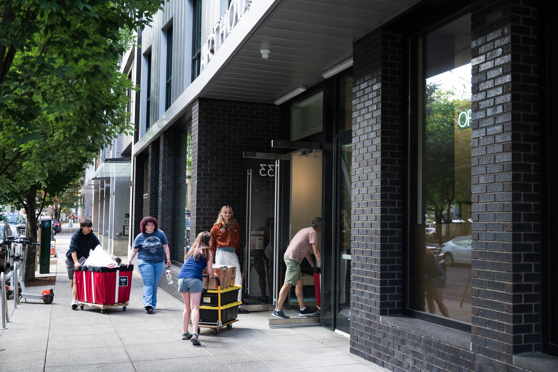students move their belongings in a dorm at PNCA in downtown Portland