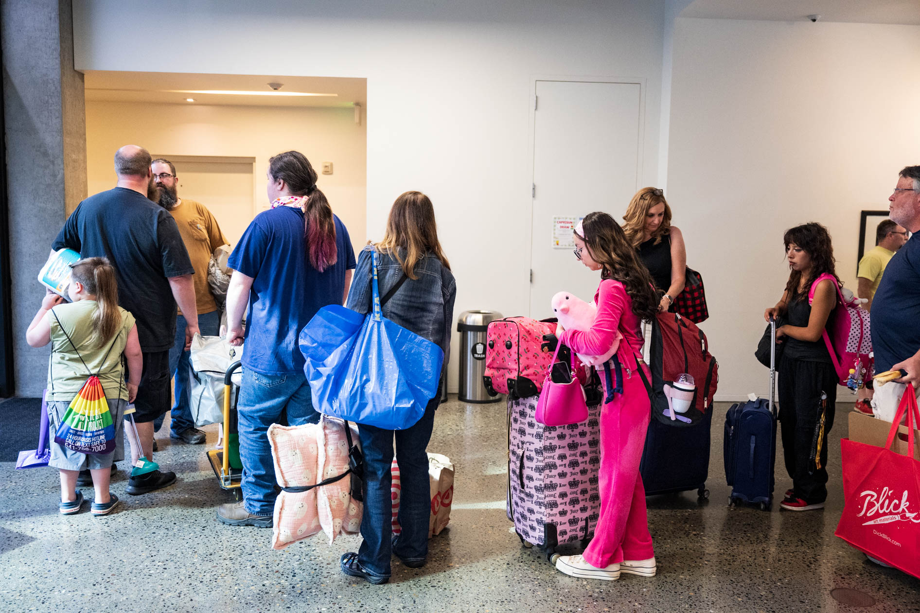 students and family members line up at a dorm move-in in downtown Portland