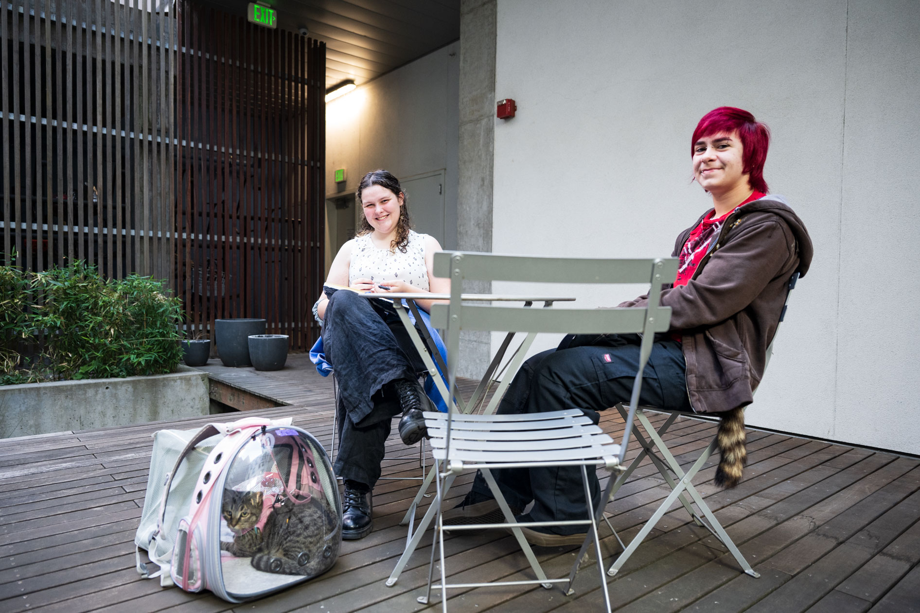 two students take a break from moving in at a dorm in downtown Portland