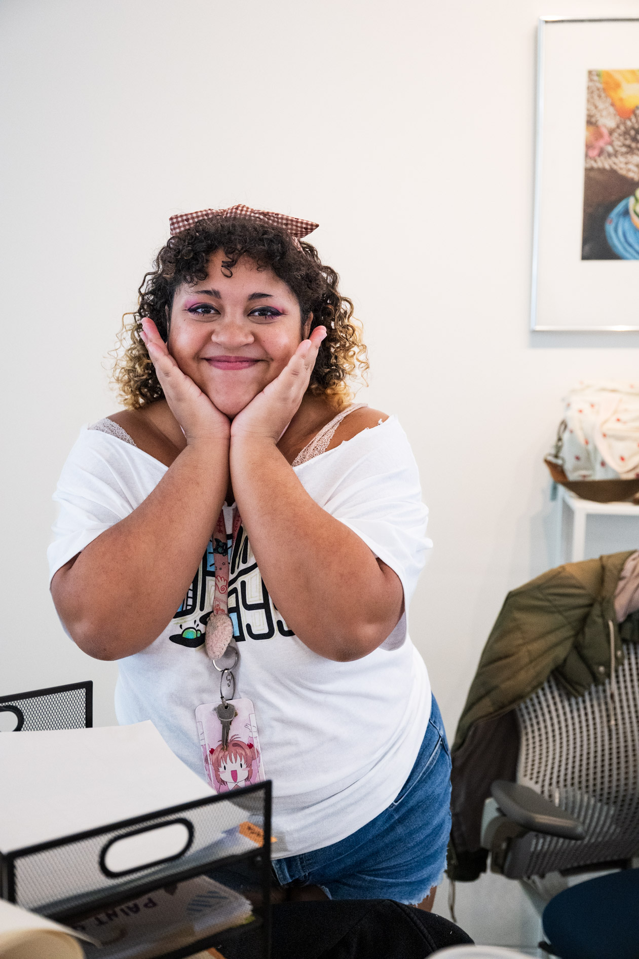 an RA poses with their hands against their face at move-in day in downtown Portland