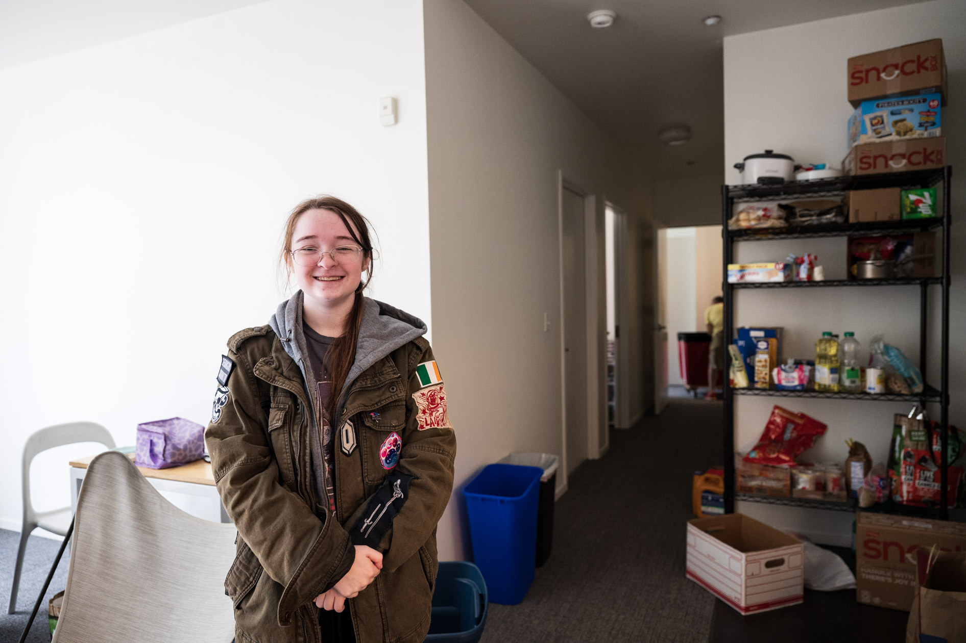 a student stands proudly in their new dorm room at PNCA in downtown Portland