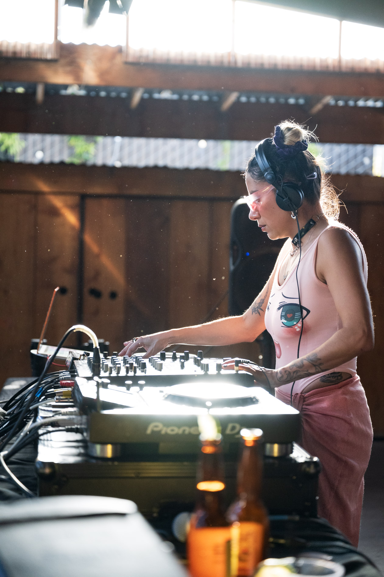 A candid photo of DJ Lapaushi performing a set at a live outdoor event in Portland. This is an example of commercial photography for an artist's portfolio.