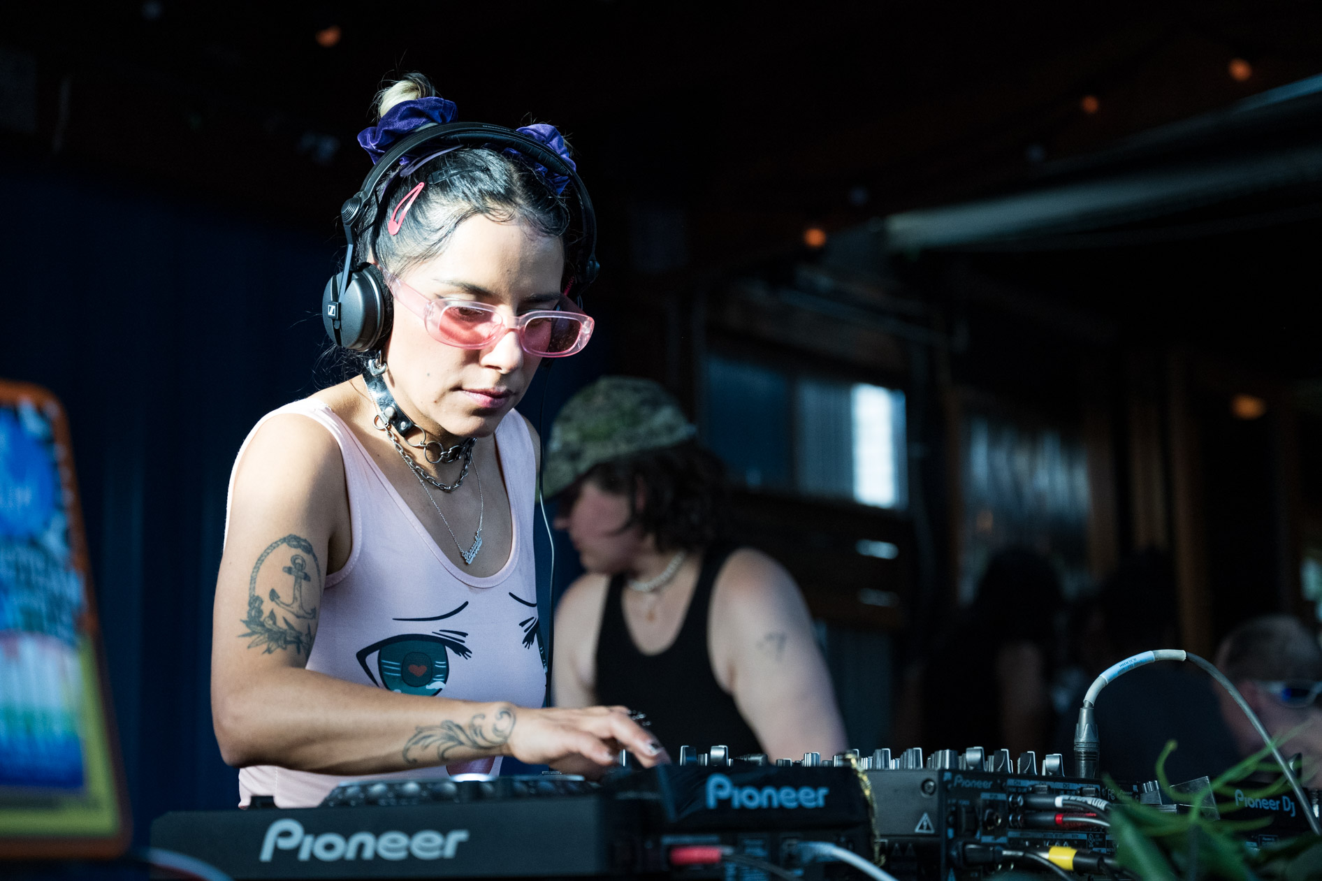 A candid photo of DJ Lapaushi performing a set at a live outdoor event in Portland. This is an example of commercial photography for an artist's portfolio.