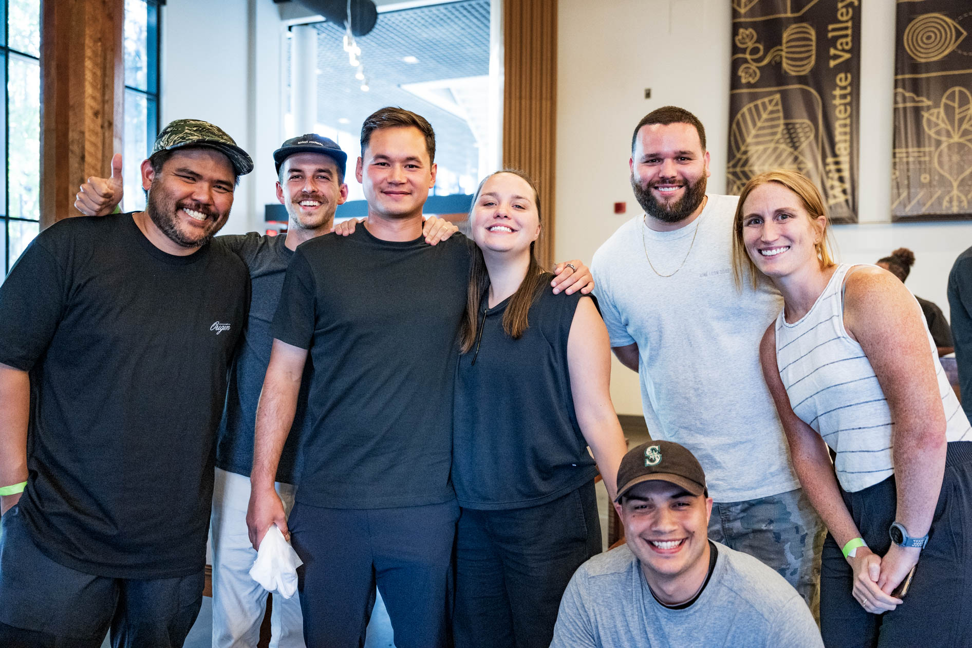 A candid group photo of smiling attendees and industry pros at Sneaker Week 2023. This showcases event photography in Portland.