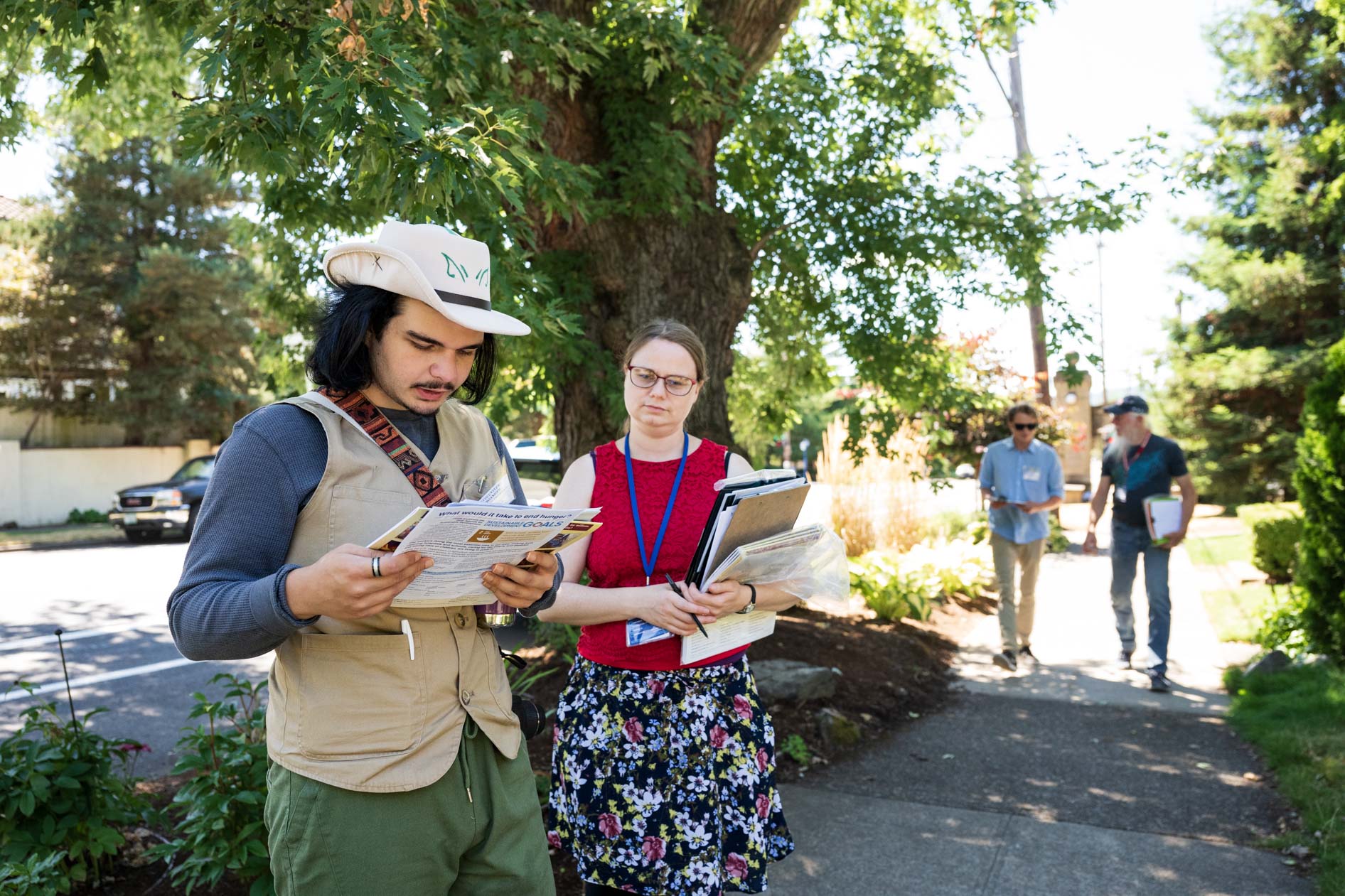 Two volunteers for Friends of Seasonal and Service Workers (FSSW) canvassing for the annual food drive in the Laurelhurst neighborhood of SE Portland.