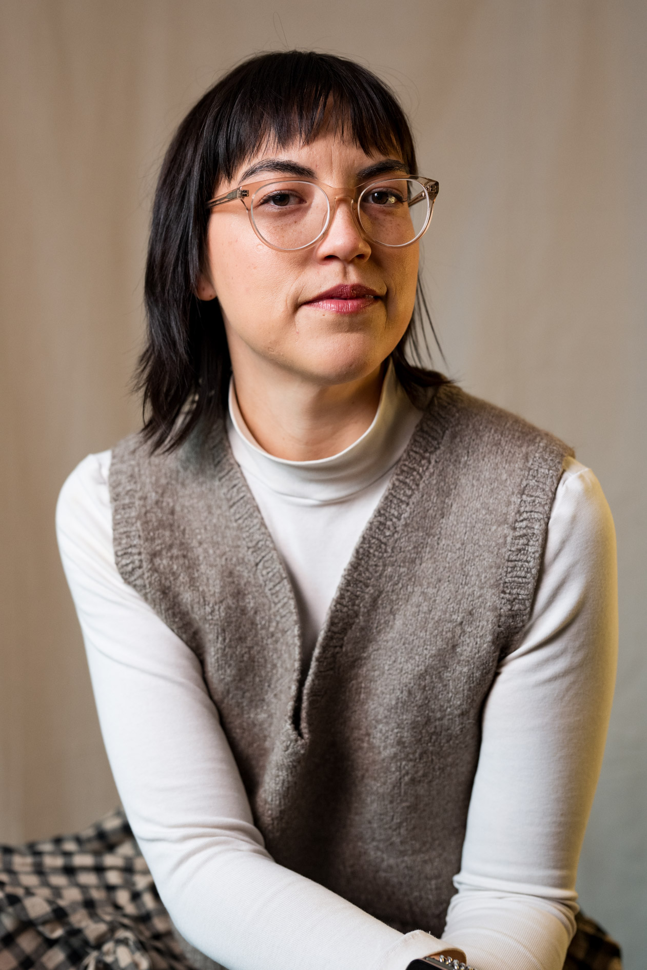 A professional inclusive portrait of Lee DeJonge in a knit vest and glasses. This showcases creative portraits in Portland, Oregon.