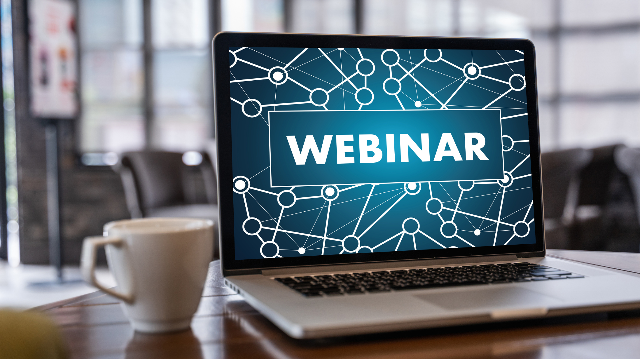 Laptop displaying a WEBINAR title screen
