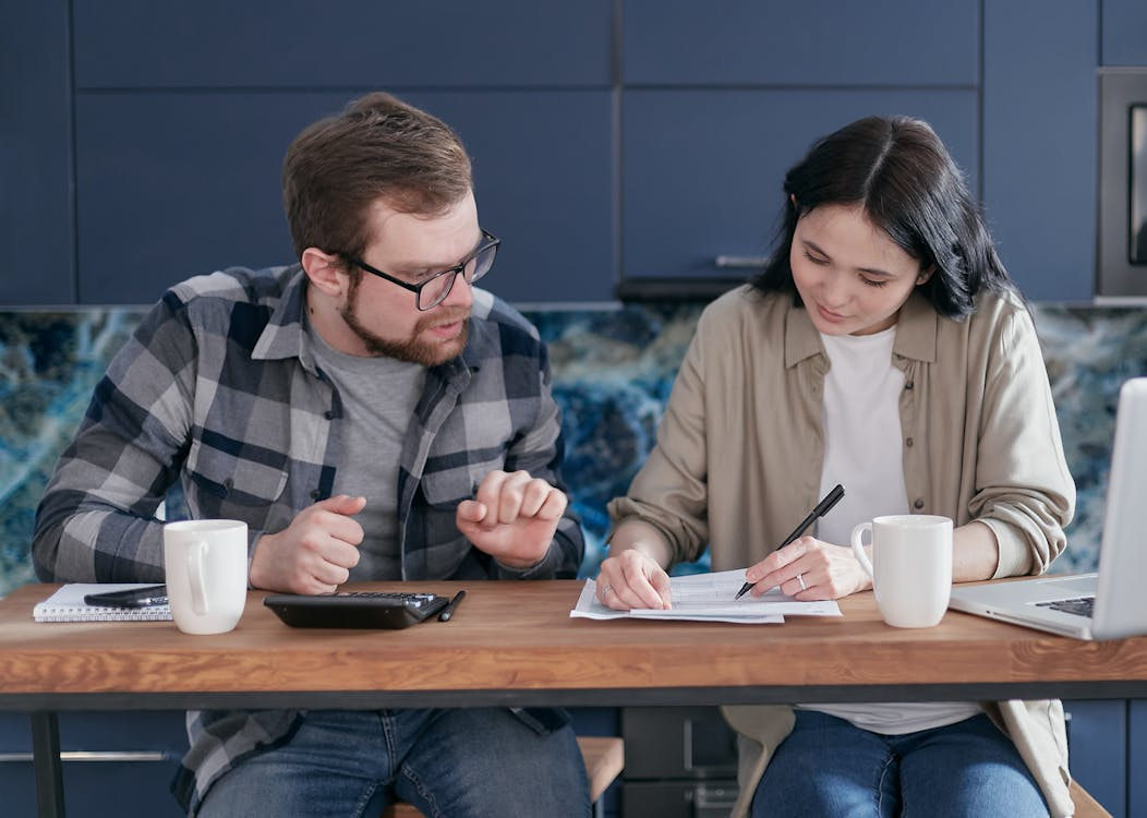 couple reviewing financial documents