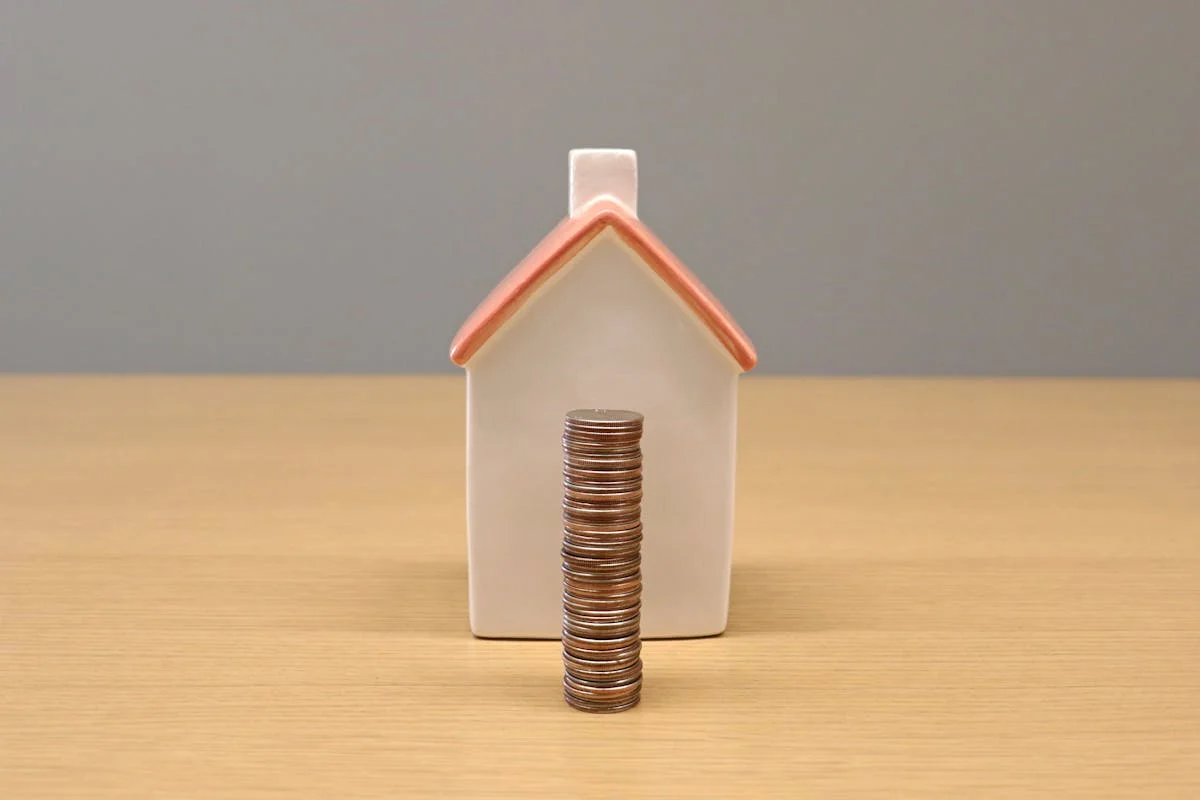 miniature home with coins