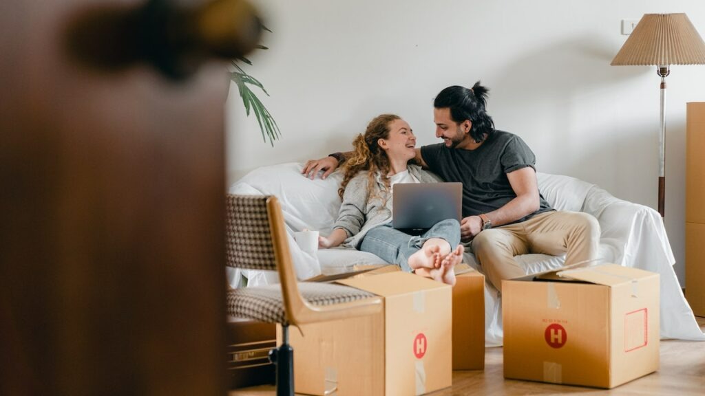 a happy couple moving in to a new home
