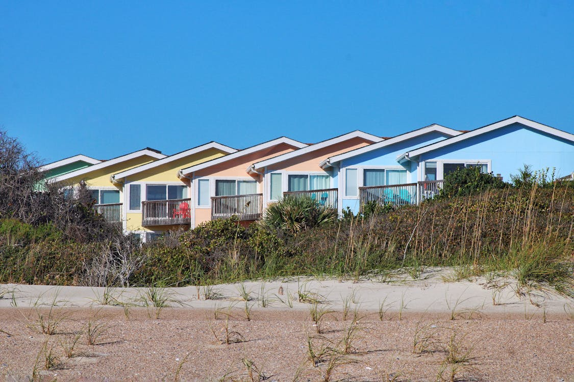 A row of rental homes along a sunny beach street