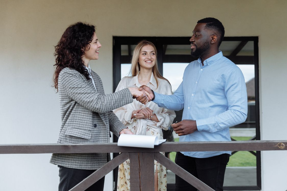 a man and a woman shaking each others hands