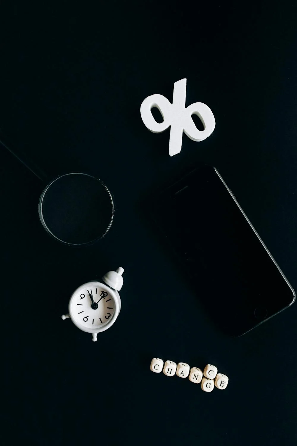 : Should You Lock Your Mortgage Rate: homebuyer using a calculator and magnifying glass to review rate numbers