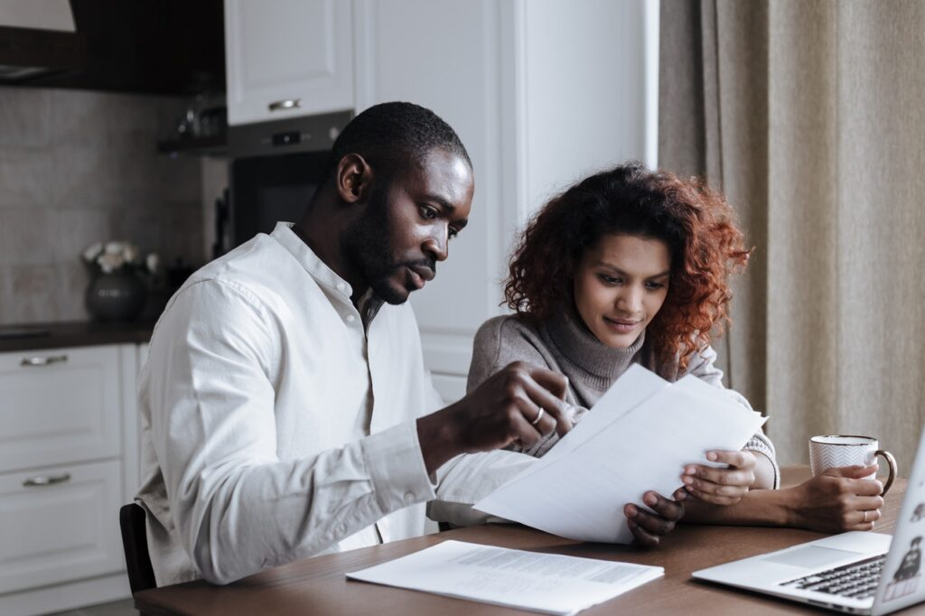How to flip your first home: a couple reviewing the housing market to finance their flip