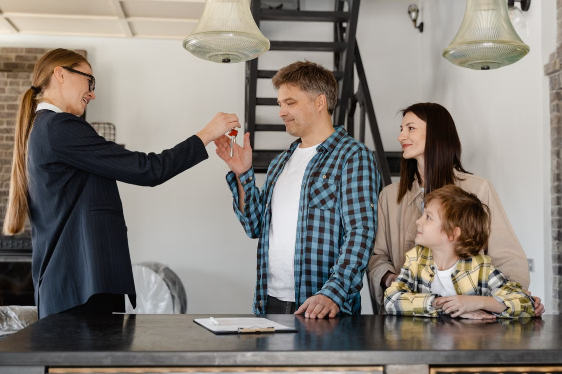 Buying a foreclosed house: keys being handed over during a home purchase