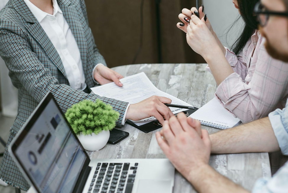 people discussing a contract