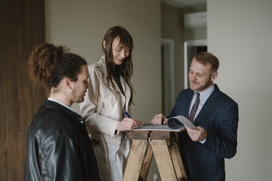 couple signing new home documents