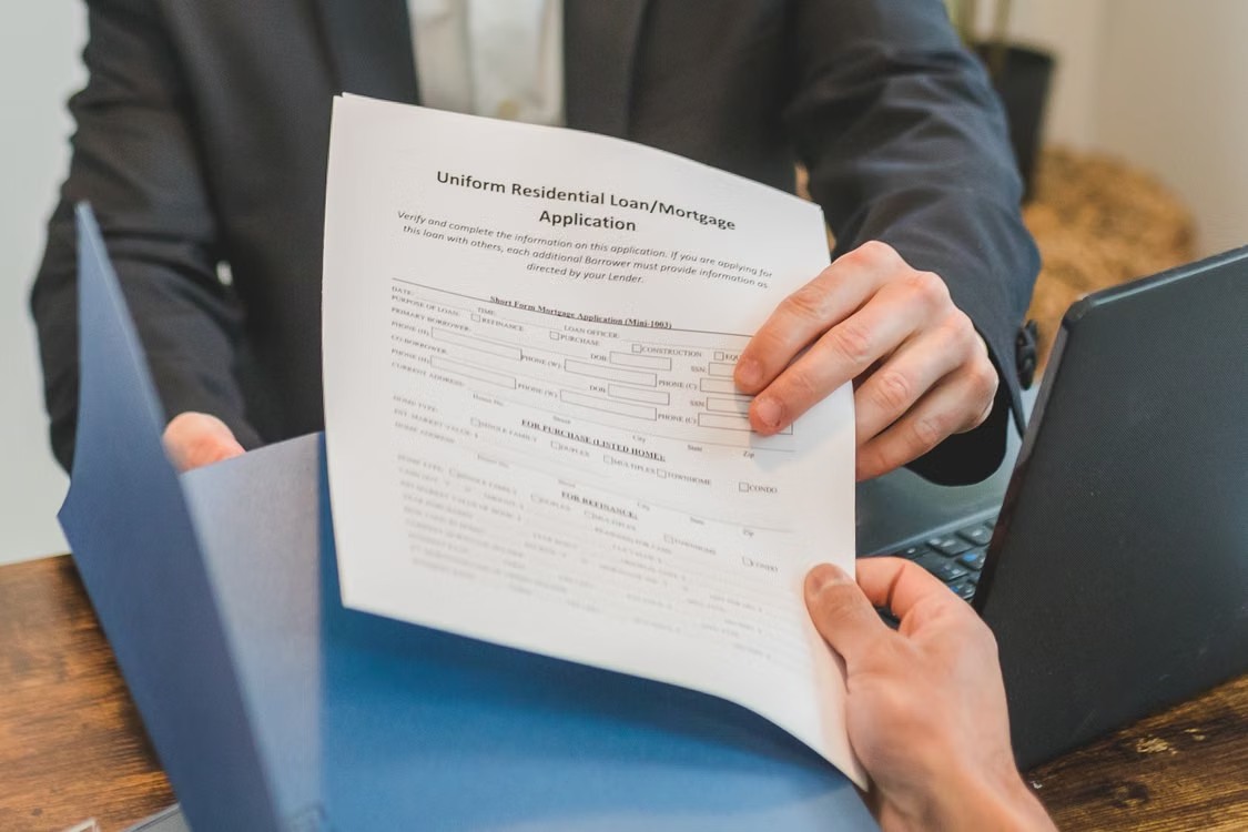  signing refinance application paperwork today