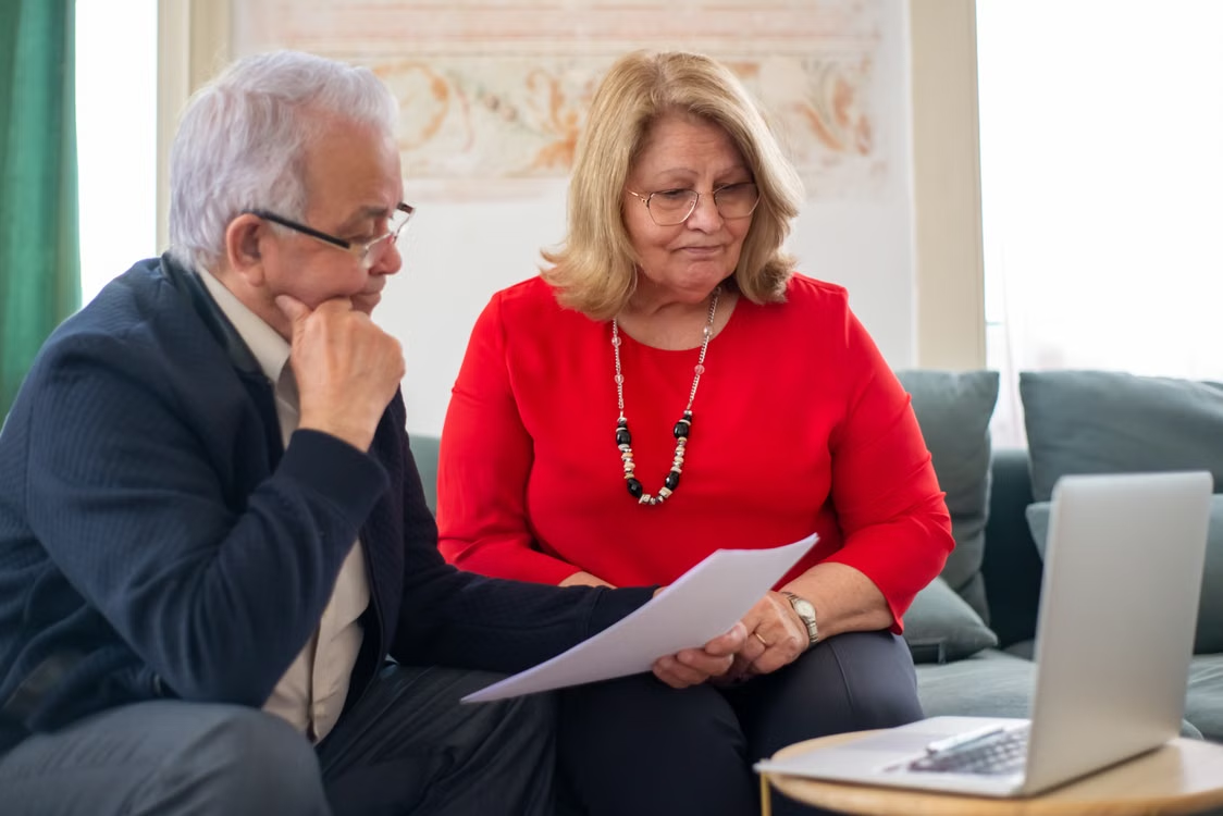 Couple Reviewing Financial Documents Together