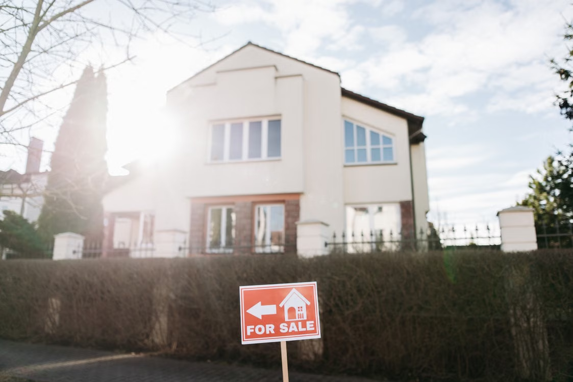 House With For Sale Sign