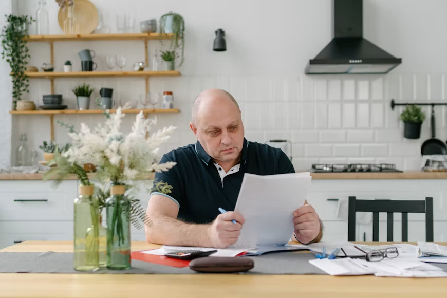  Homeowner comparing current mortgage rate to refinance options