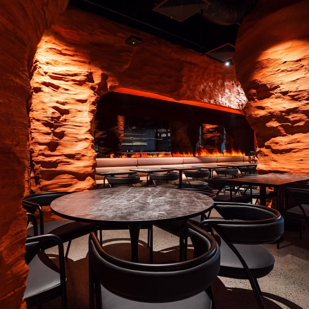 Bride and groom embracing in a lush outdoor setting, capturing romantic storytelling through wedding photography.