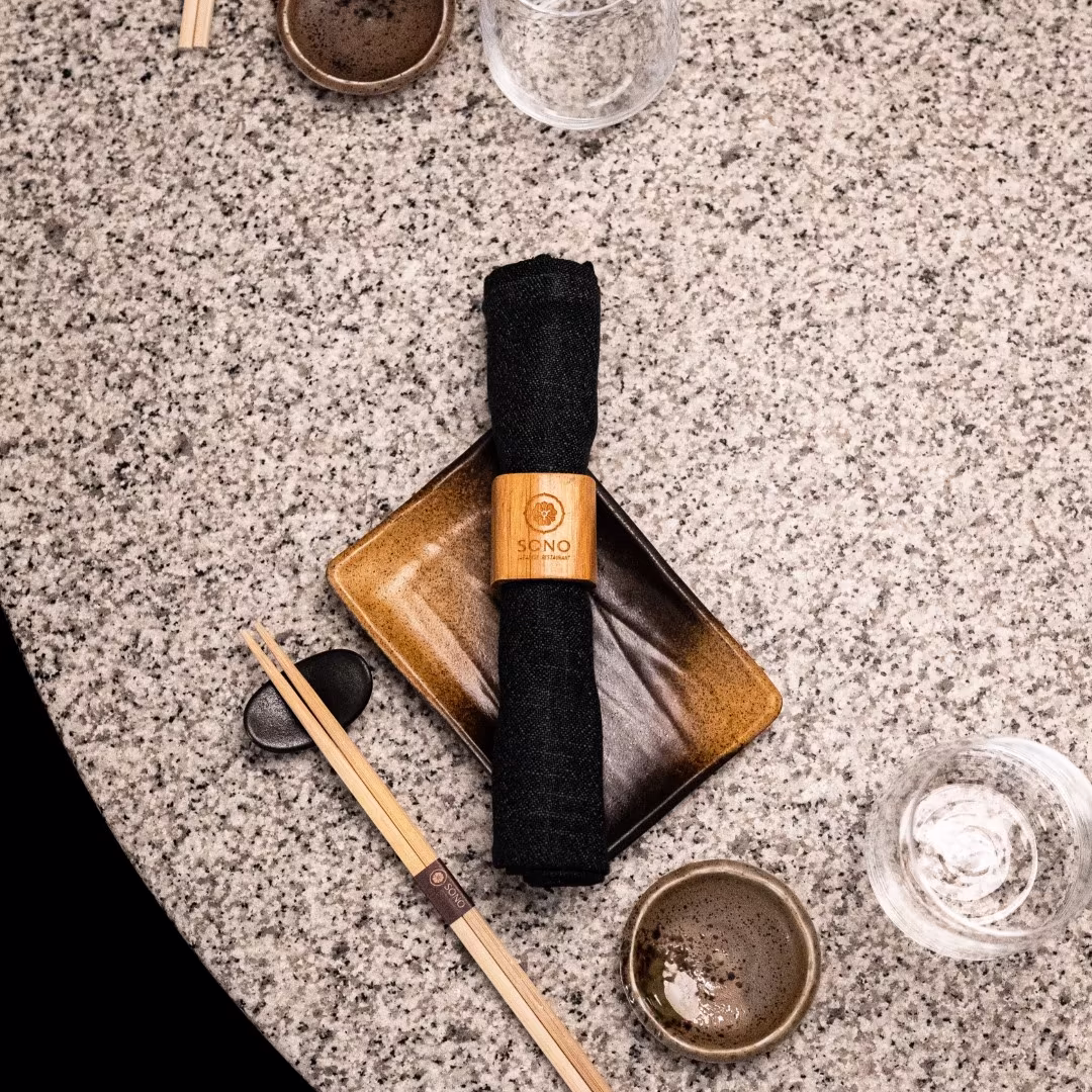 Fashion model posing with a snake under bright lighting, showcasing bold creative photography and brand identity.