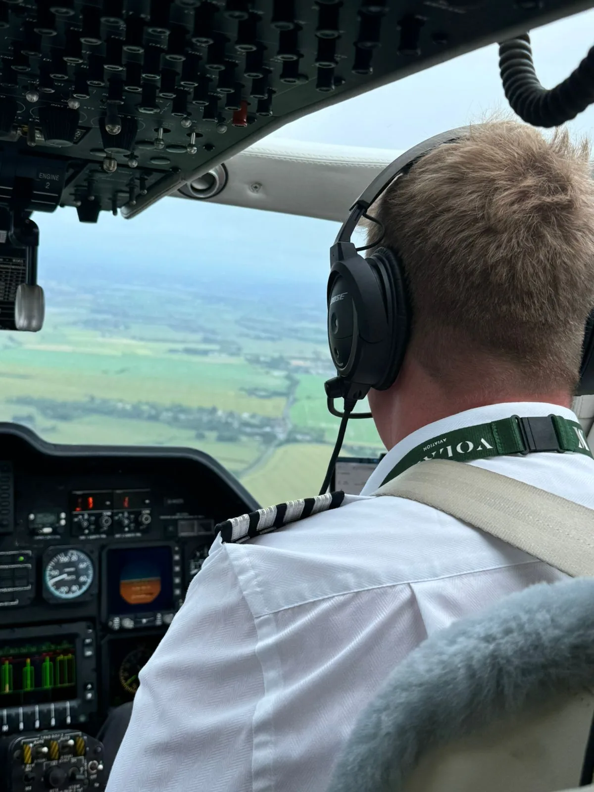 Pilot flying a private aircraft over the countryside