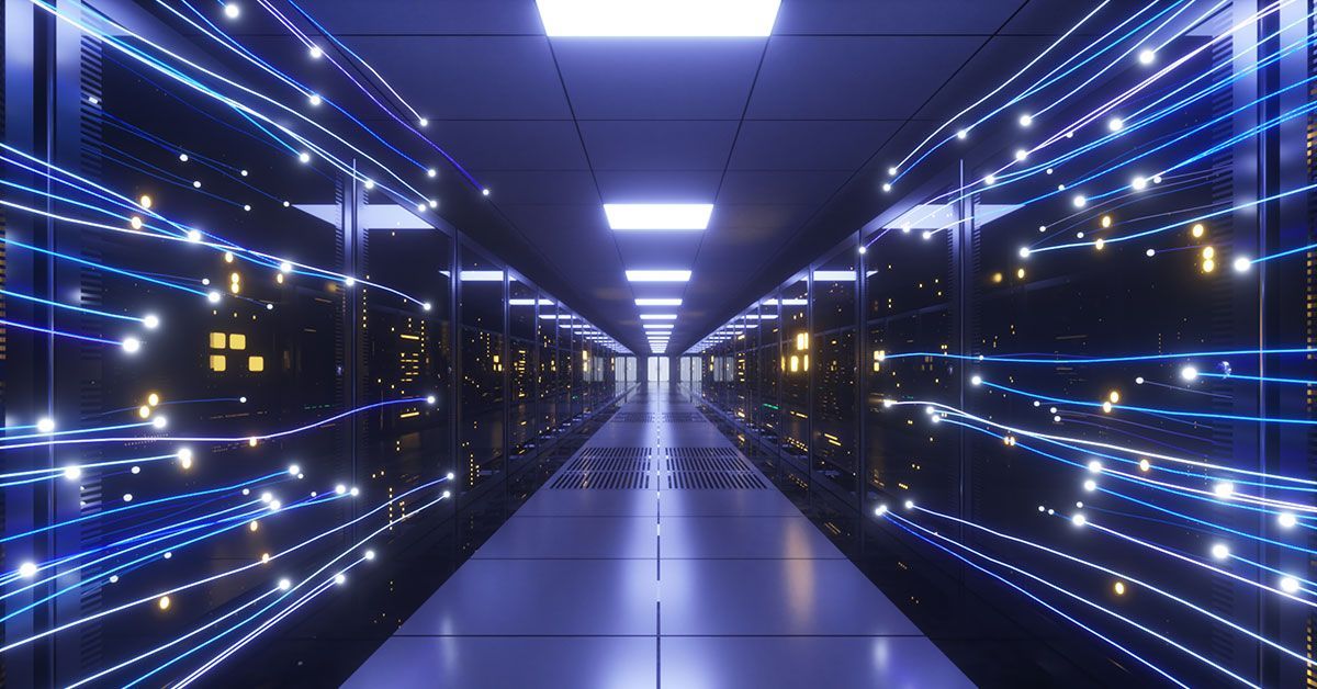 A glowing, high-tech server room aisle with blue fiber-optic light trails streaming past dark data center server racks.