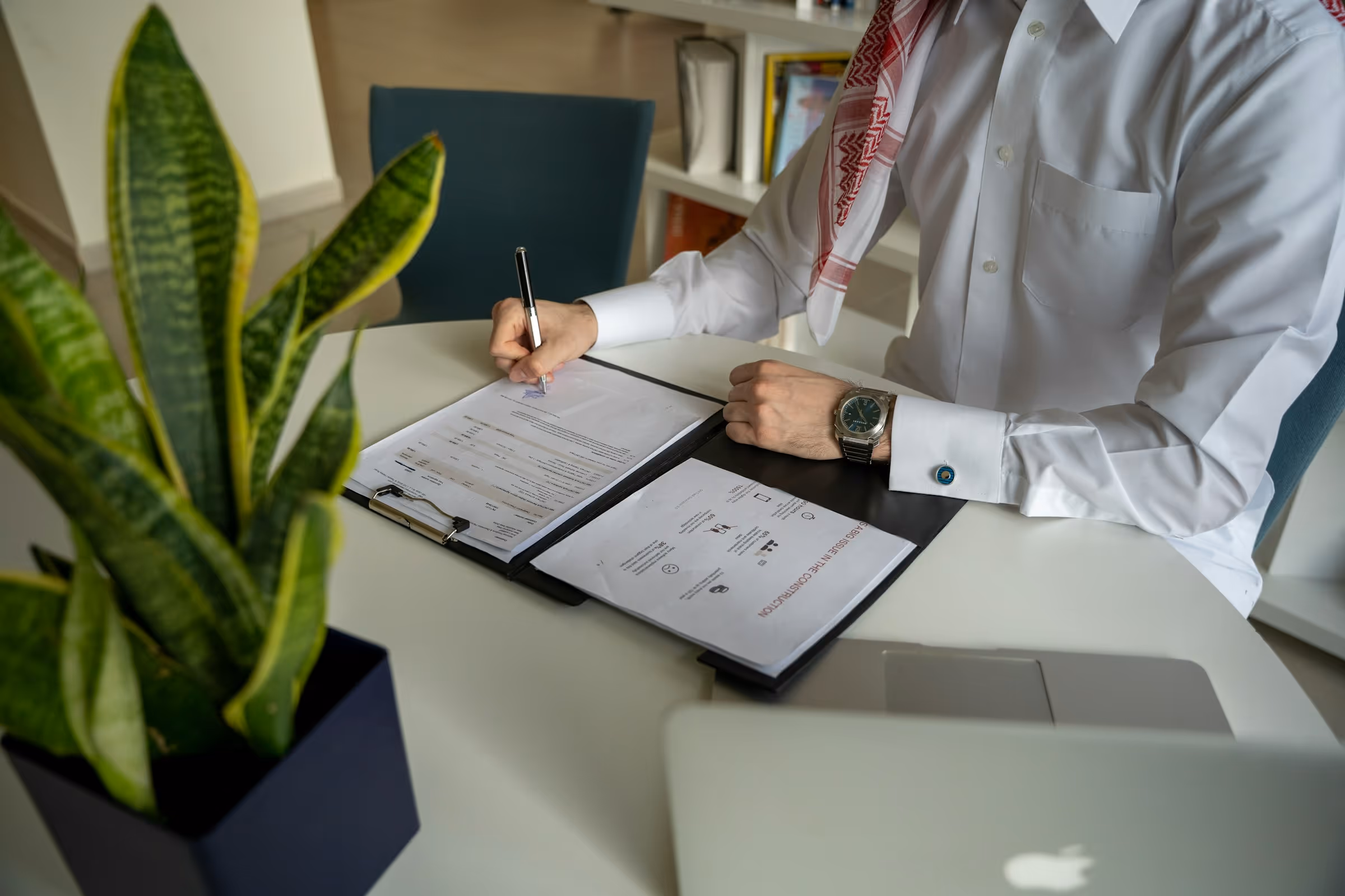person reviewing documents - Recruitment Process In UAE