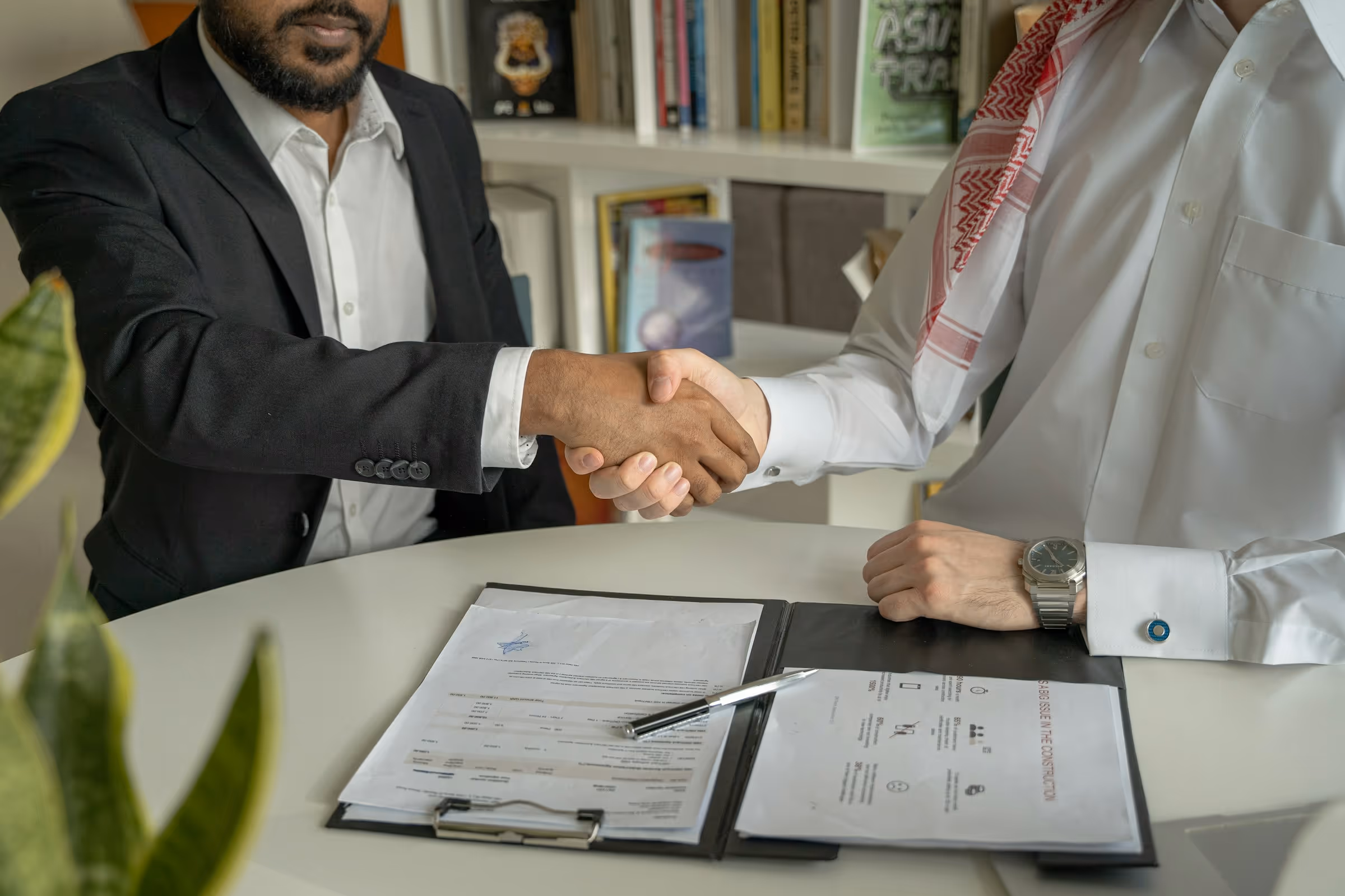 men shaking hands - Saudi Labour Law